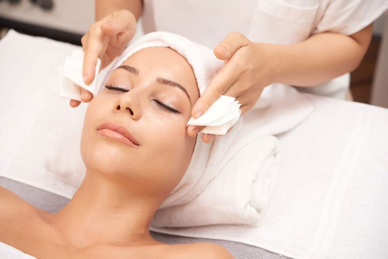 Attractive woman getting face beauty procedures